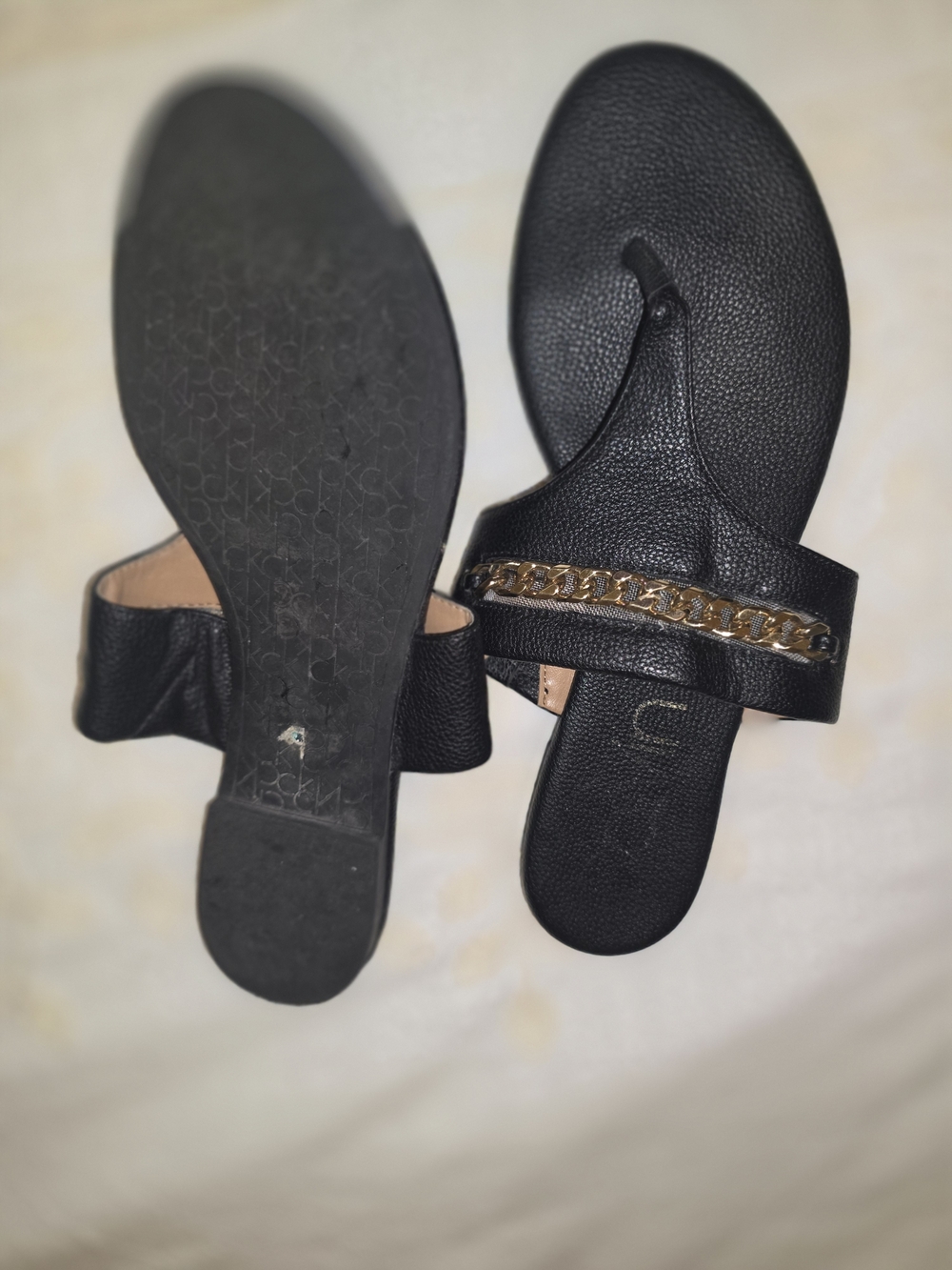 Calvin Klein Black Thong Sandals with Gold Chain Accent